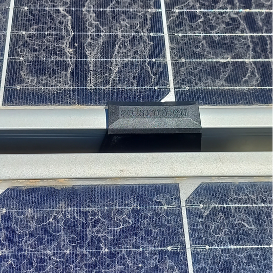 Solar panel with 'solarud.eu' branding on draining water